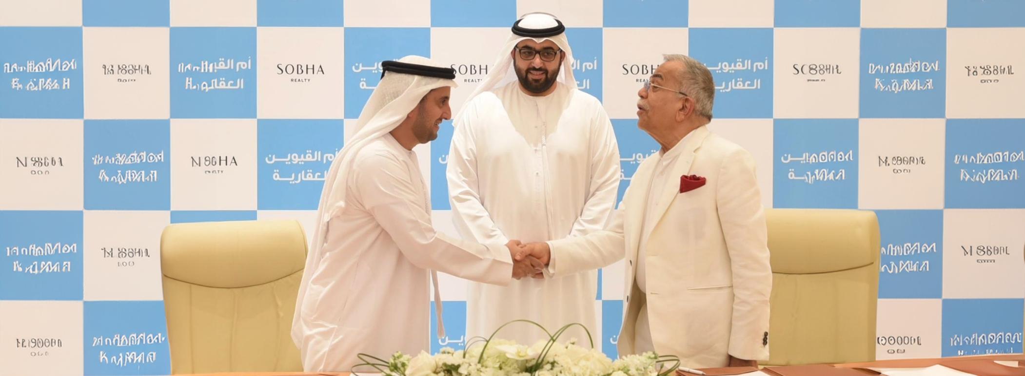 Rashid bin Saud Al Mualla witnesses the signing of a partnership agreement between Umm Al Quwain Properties and Sobha Realty
